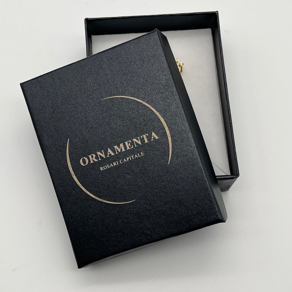 Bracciale in acciaio con croce e catenina regolabile