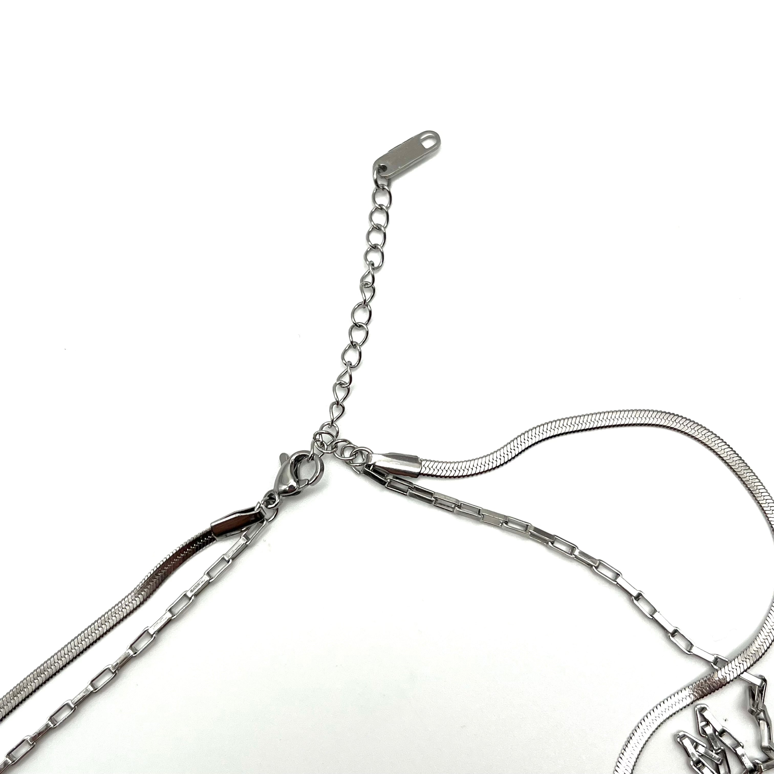 Collana in acciaio inox a doppio filo con croci pendenti – versione silver